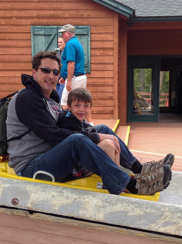 Father and son on Alpine Slide at Breckenridge Fun Park